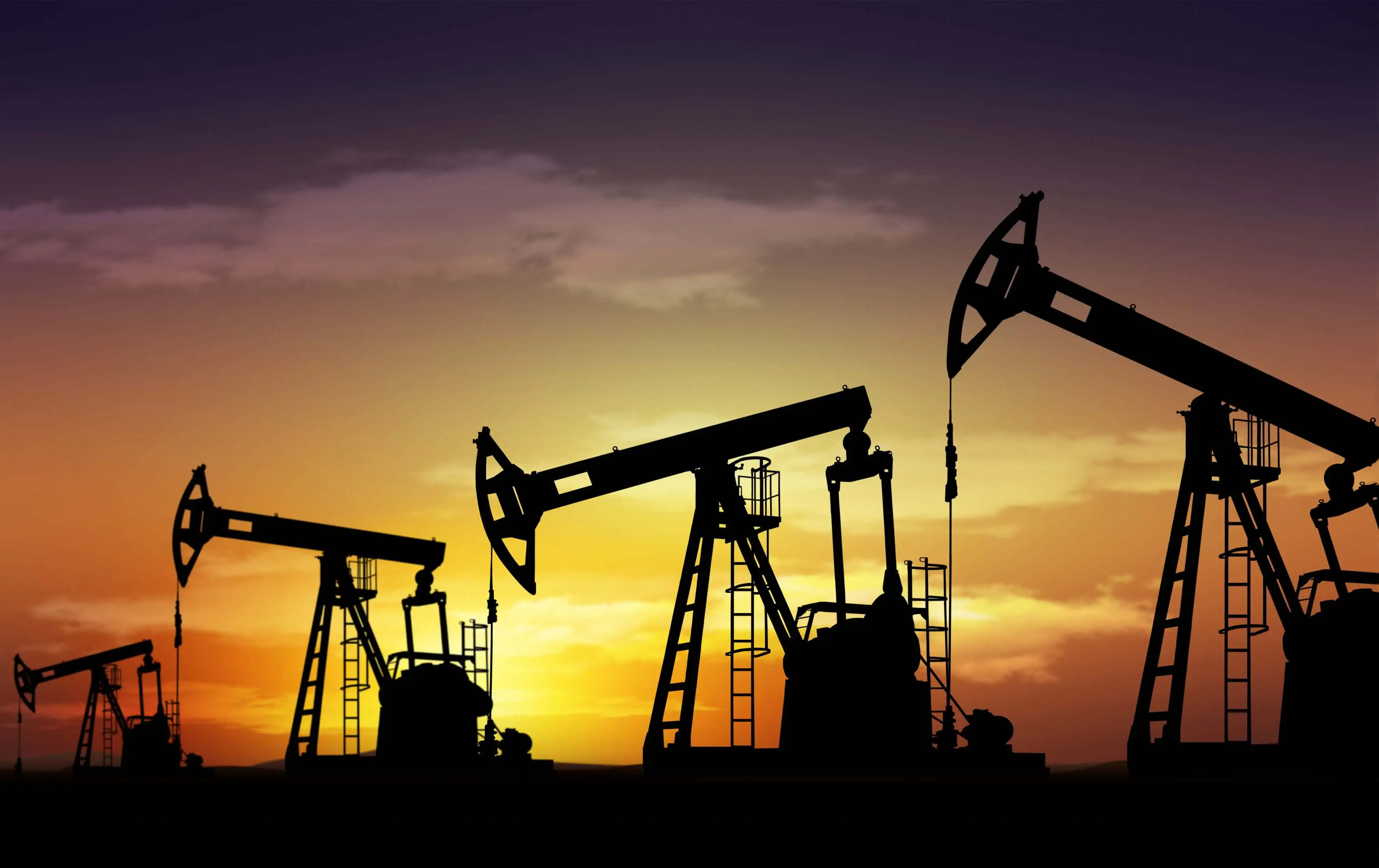 Oil field pumpjacks at sunset, Turkmenistan